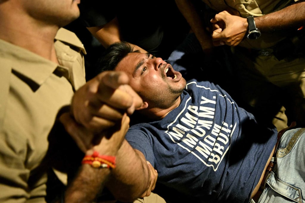 Police detain a Cockroach Janata Party supporter during a protest demanding the resignation of India’s Chief Election Commissioner Gyanesh Kumar over alleged voter roll irregularities linked to the special intensive revision in Ahmedabad on October 10. Photo: AFP Police detain a Cockroach Janata Party supporter during a protest demanding the resignation of India’s Chief Election Commissioner Gyanesh Kumar over alleged voter roll irregularities linked to the special intensive revision in Ahmedabad on October 10. Photo: AFP