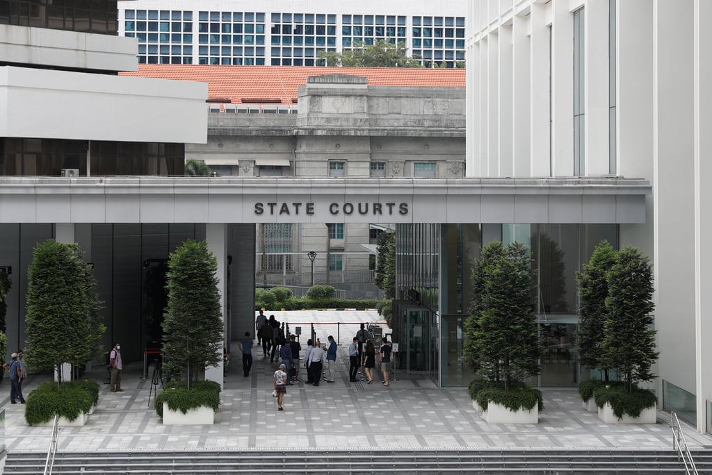 People enter the Singapore State Courts. Photo: Reuters