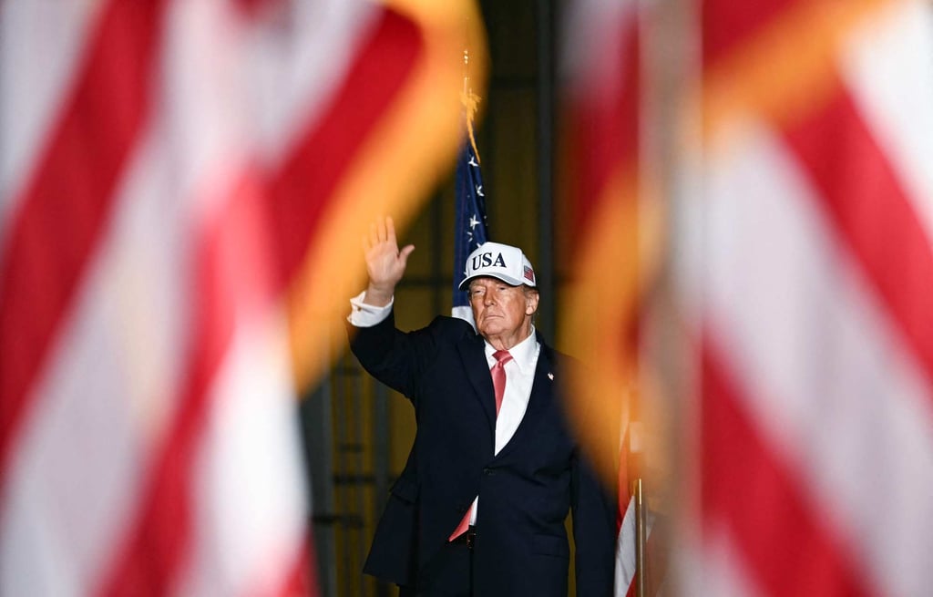 US President Donald Trump waves after speaking at a midterm campaign rally in Greenville, North Carolina, on Tuesday. Photo: AFP