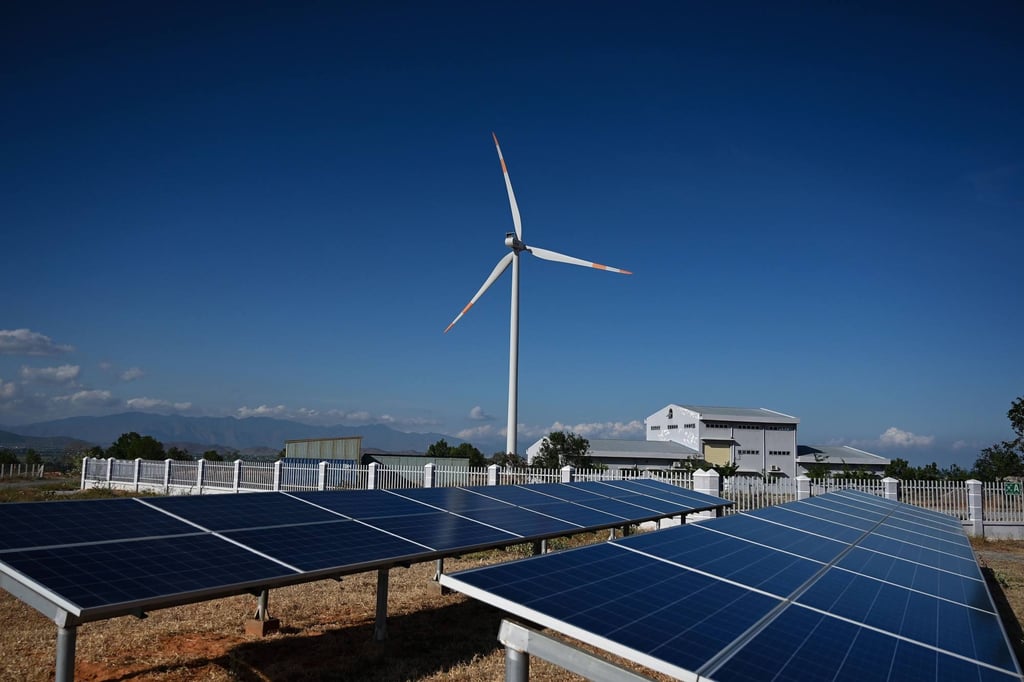 Solar panel installations and a wind turbine at a wind farm in Vietnam’s Binh Thuan province. Photo: AFP