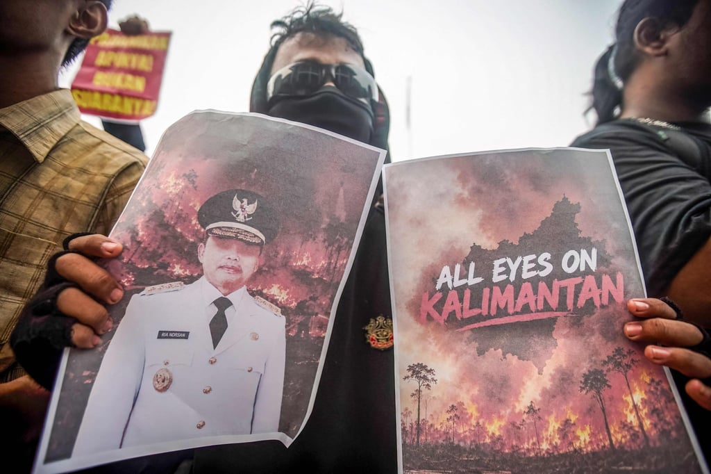 Student protesters hold posters during a rally against forest and land fires as well as various national issues in Pontianak, West Kalimantan, on Wednesday. Photo: AFP