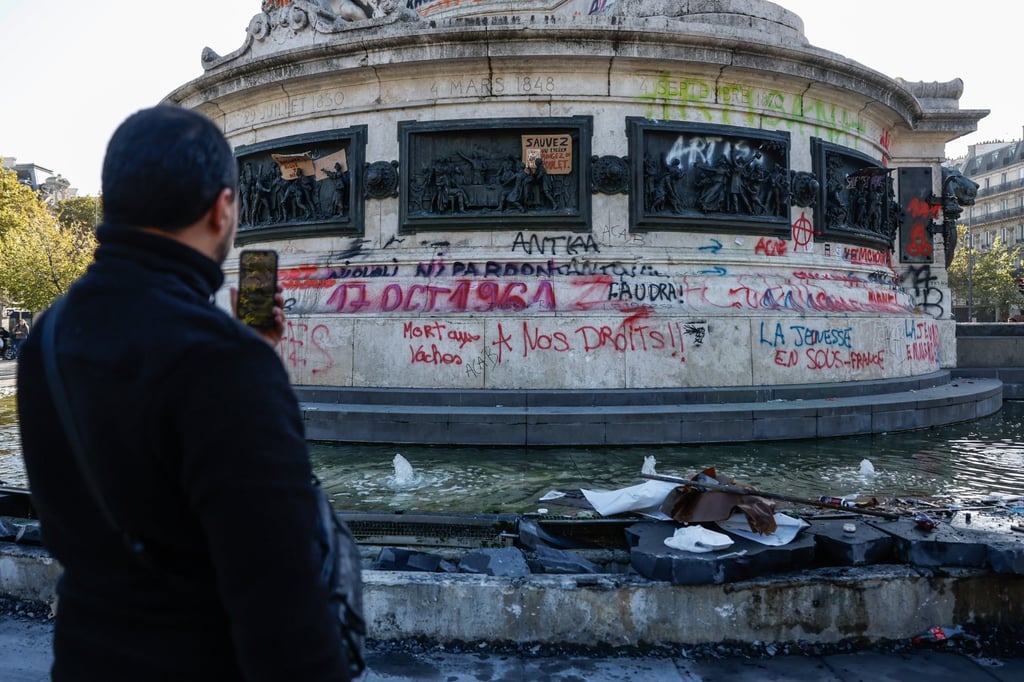 The Statue de la Republique is covered in graffiti following clashes between riot police and demonstrators during nationwide protests against the high cost of living in the country in Paris on 18 October. Photo: EPA The Statue de la Republique is covered in graffiti following clashes between riot police and demonstrators during nationwide protests against the high cost of living in the country in Paris on 18 October. Photo: EPA