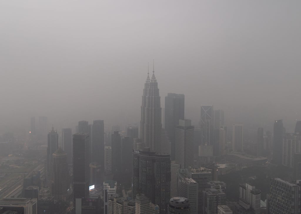 Haze blankets the Petronas Twin Towers and the rest of the skyline of Kuala Lumpur, Malaysia on Friday. Photo: AP