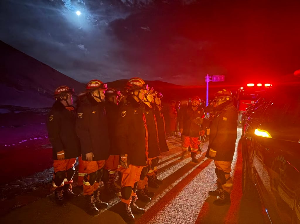 Firefighters arrive at an earthquake-hit village. Photo: Xinhua Firefighters arrive at an earthquake-hit village. Photo: Xinhua