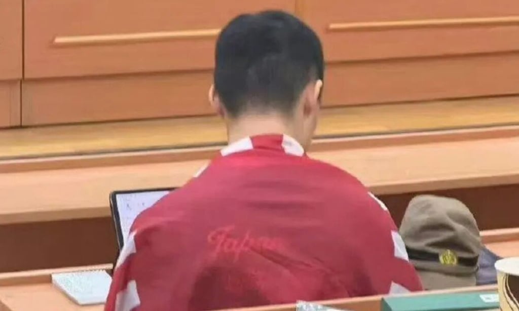 A Chinese student surnamed Chen brought a Japanese military cap from the 1930s to class and draped the rising sun flag over himself, sources said. Photo: Handout