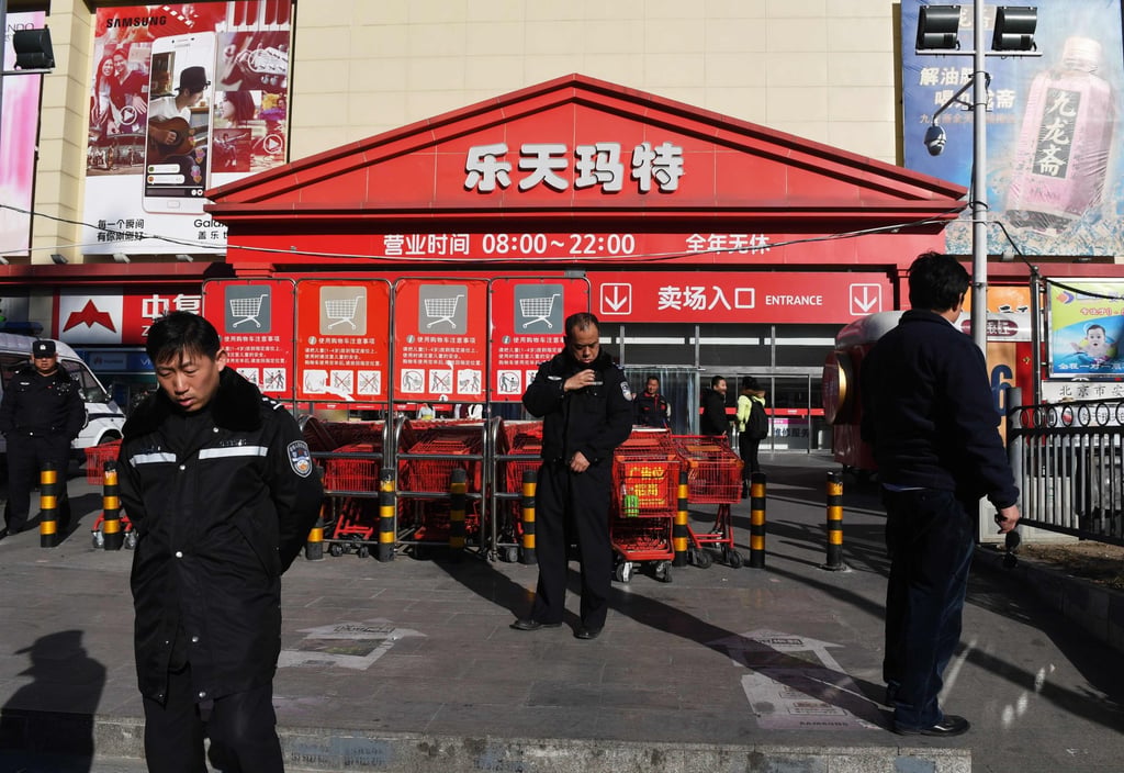 Police officers patrol outside a Lotte Mart in Beijing on March 9, 2017. The store remained open but dozens of other Lotte stores in China were closed amid diplomatic rows over a US missile system sparked boycott calls from Beijing against Seoul. Photo: AFP Police officers patrol outside a Lotte Mart in Beijing on March 9, 2017. The store remained open but dozens of other Lotte stores in China were closed amid diplomatic rows over a US missile system sparked boycott calls from Beijing against Seoul. Photo: AFP