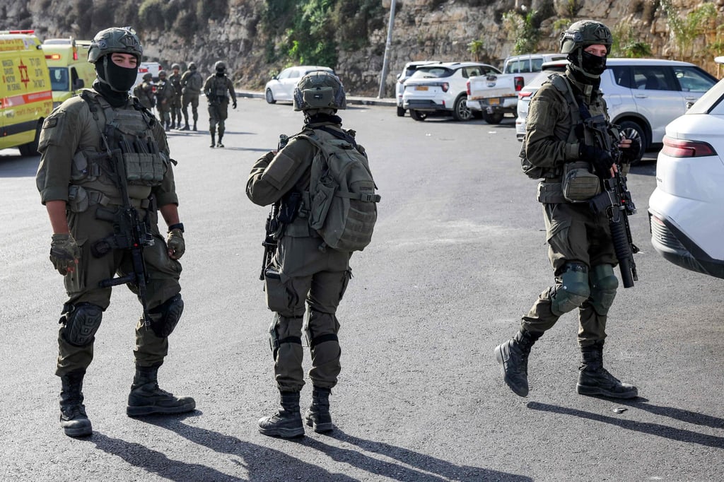 Israeli soldiers at the scene. Photo: AFP Israeli soldiers at the scene. Photo: AFP