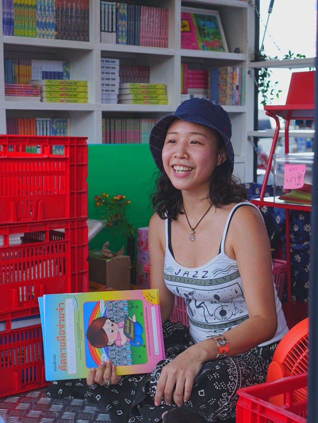 Yasawath Chuthivisitrathikul on the Somelee book truck during one of its stops. The project is travelling through Thailand to make books more accessible to rural communities. Photo: P.S. Publishing