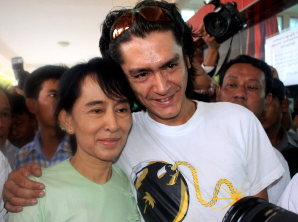 Aung San Suu Kyi poses with her son, Kim Aris, at Bagan airport before leaving for Yangon on July 8, 2011. Photo: AP Aung San Suu Kyi poses with her son, Kim Aris, at Bagan airport before leaving for Yangon on July 8, 2011. Photo: AP