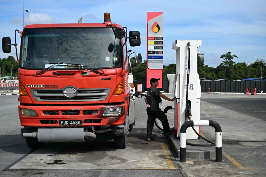 A man fills his truck with diesel at a Petros station in Kuching on June 20, 2025. Photo: AFP