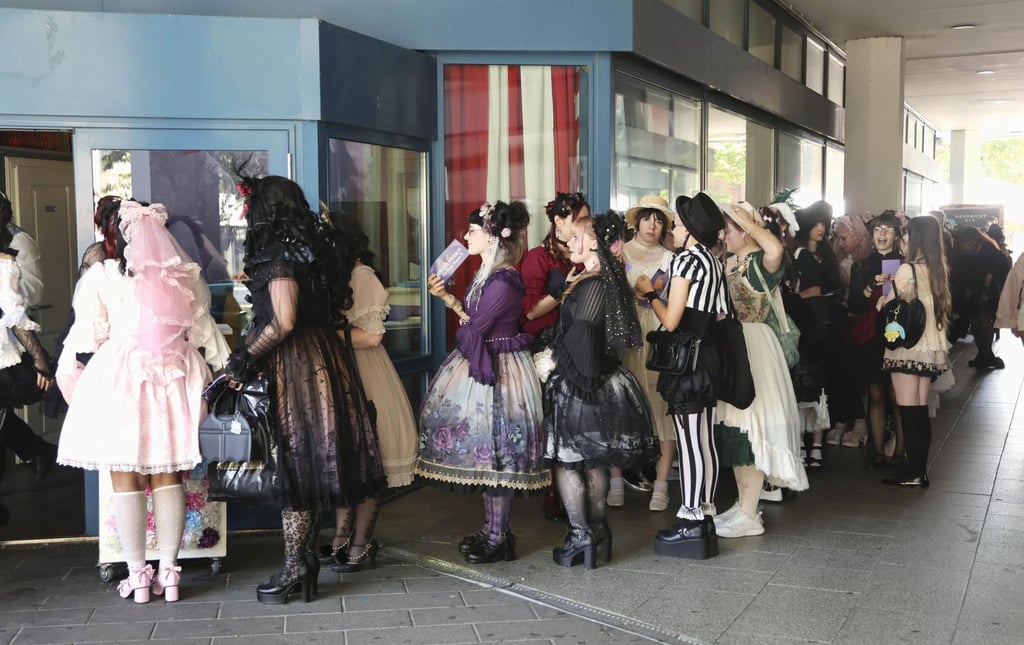 Gothic Lolita fashion enthusiasts queue outside the venue of a gathering in Berlin in August. Photo: Kyodo Gothic Lolita fashion enthusiasts queue outside the venue of a gathering in Berlin in August. Photo: Kyodo