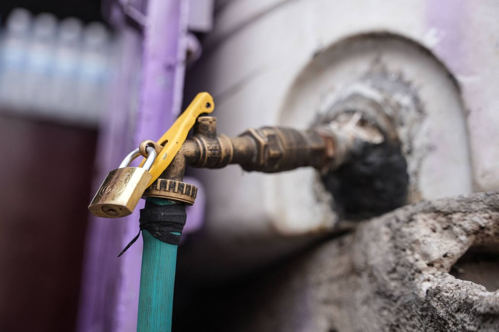 A padlock secures a water tap connected to a storage tank in Taiz, Yemen, on Tuesday amid severe shortages. Photo: AFP A padlock secures a water tap connected to a storage tank in Taiz, Yemen, on Tuesday amid severe shortages. Photo: AFP
