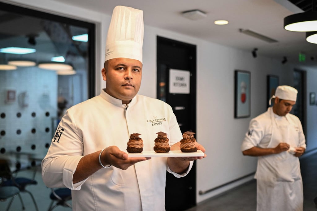 Bakery and pastry training director Aabhas Jain with a plate of pastries at the Ecole Ducasse, a French culinary school in Gurugram, India. Photo: AFP
