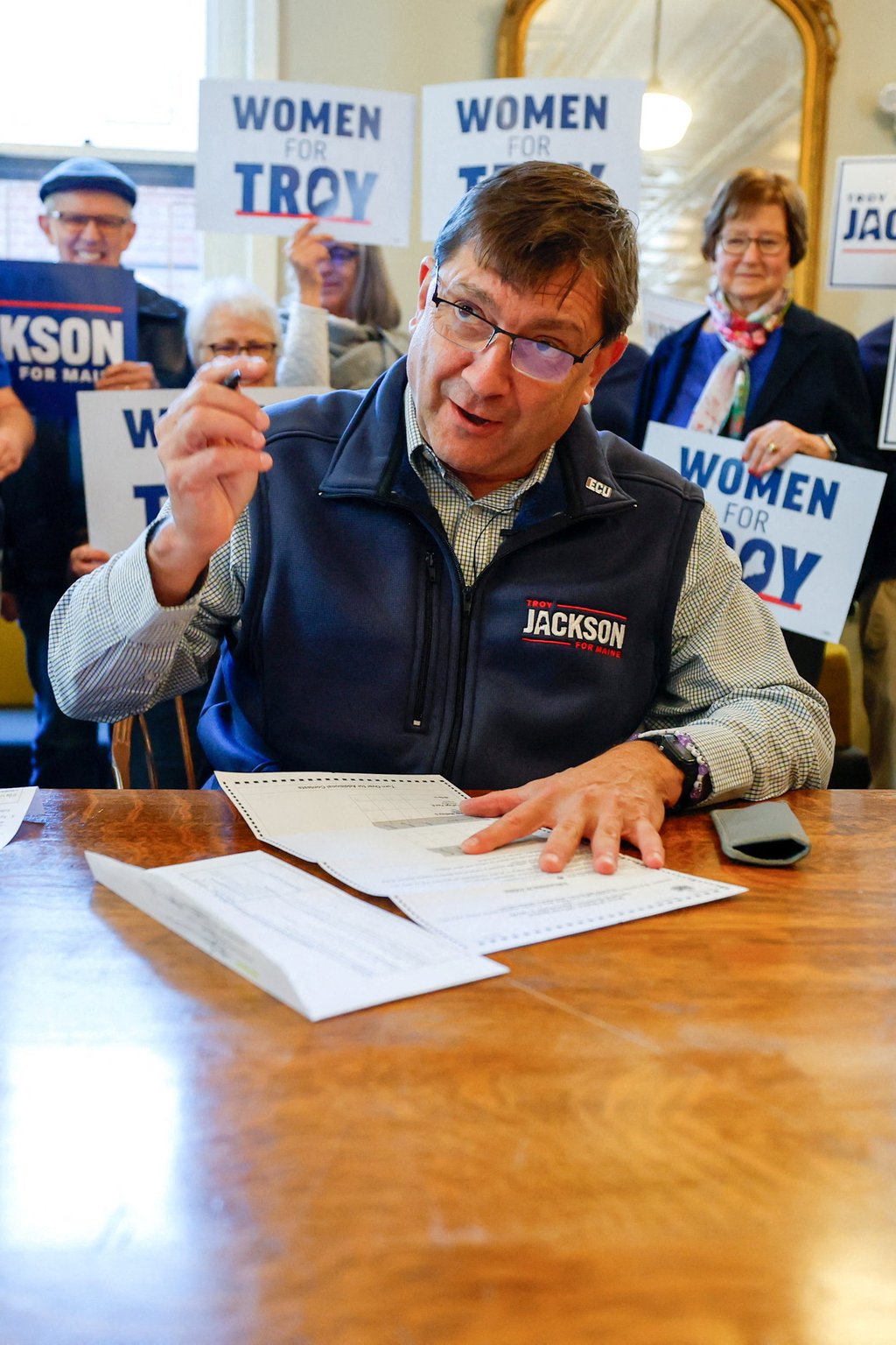 Democratic US Senate candidate Troy Jackson fills out his postal vote next to supporters in Portland, Maine, on Friday. Photo: Reuters Democratic US Senate candidate Troy Jackson fills out his postal vote next to supporters in Portland, Maine, on Friday. Photo: Reuters