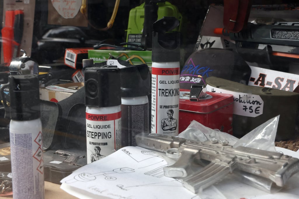 Items, including pepper spray canisters, on display in the window of a gun shop in Paris, France, on Thursday. Photo: Reuters Items, including pepper spray canisters, on display in the window of a gun shop in Paris, France, on Thursday. Photo: Reuters