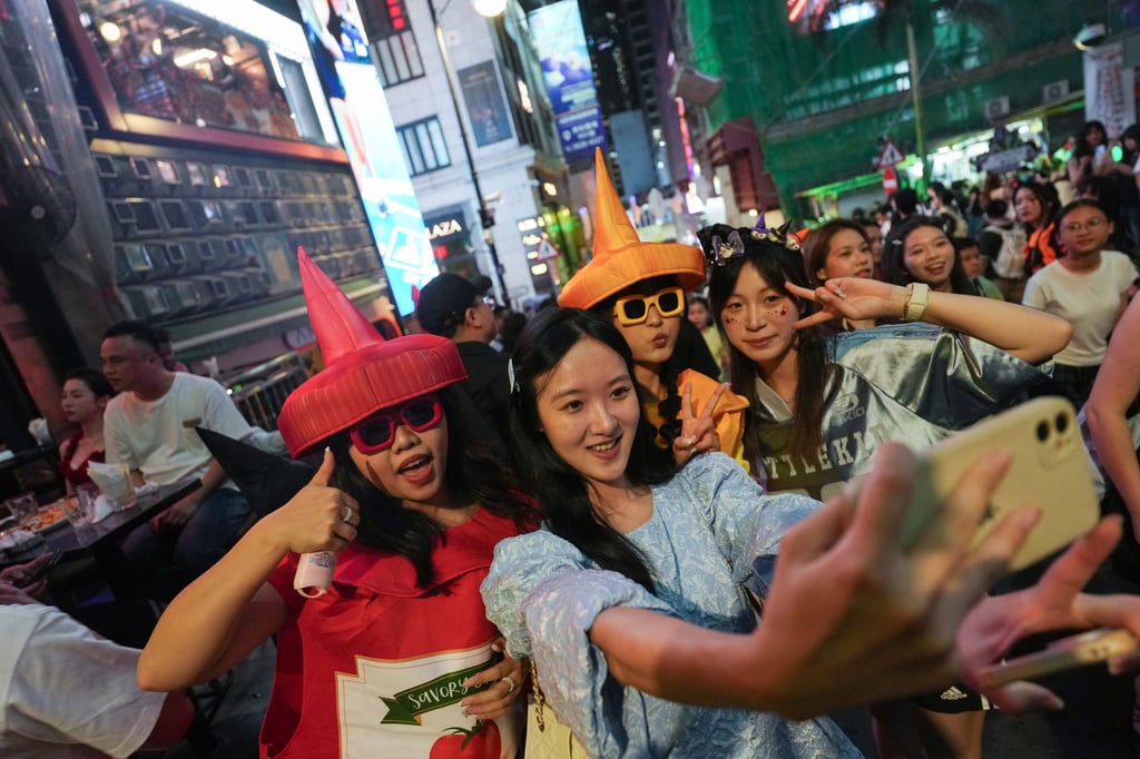 People celebrate in Lan Kwai Fong on Saturday, ahead of Halloween. Photo: Kit Lai