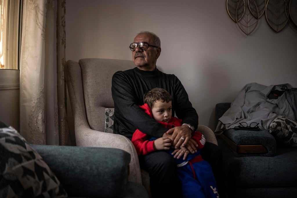 West Bank resident Khaled Shawer al-Tamimi with his grandson in Hebron. Photo: AFP West Bank resident Khaled Shawer al-Tamimi with his grandson in Hebron. Photo: AFP