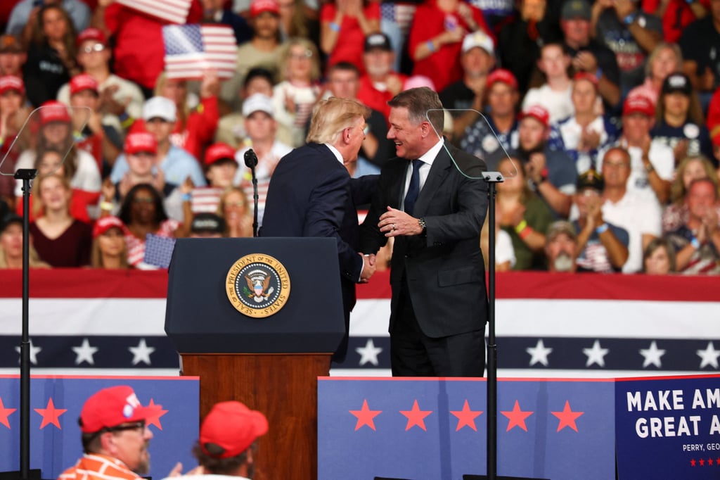 Trump (left) greets Audi CEO Gernot Dollner in Perry, Georgia. Photo: Reuters