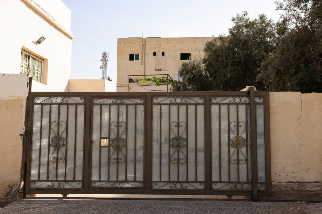 A building shows signs of gunfire at the site where Jordanian security forces arrested three suspects in connection with the deadly church shooting, in the Al-Judayyda area of Karak, Jordan, on Monday. Photo: Reuters