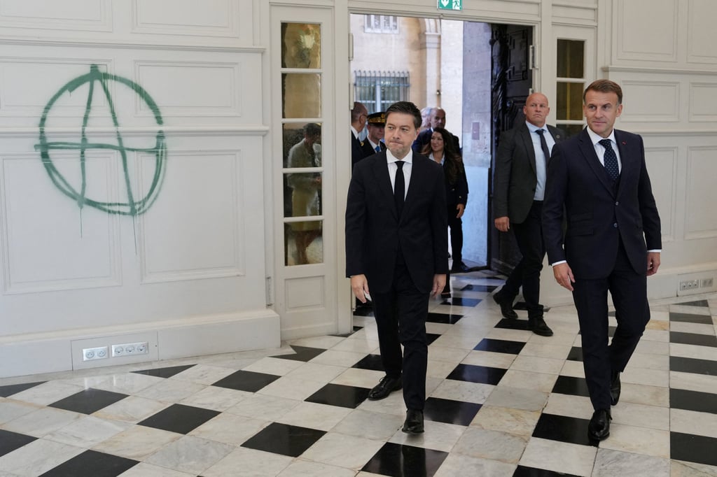 French President Emmanuel Macron (right) and Marseille Mayor Benoit Payan enter the city hall which was recently vandalised, in Marseille on Monday. Photo: via Reuters French President Emmanuel Macron (right) and Marseille Mayor Benoit Payan enter the city hall which was recently vandalised, in Marseille on Monday. Photo: via Reuters