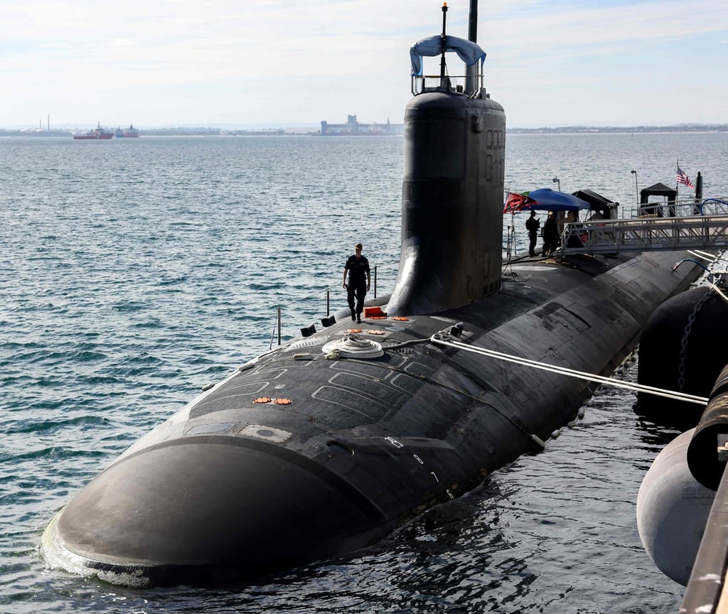 US Navy officers stand guard aboard the Virginia-class fast-attack submarine USS Minnesota docked at HMAS Stirling in Rockingham, Western Australia, on February 26, 2025. Photo: AFP