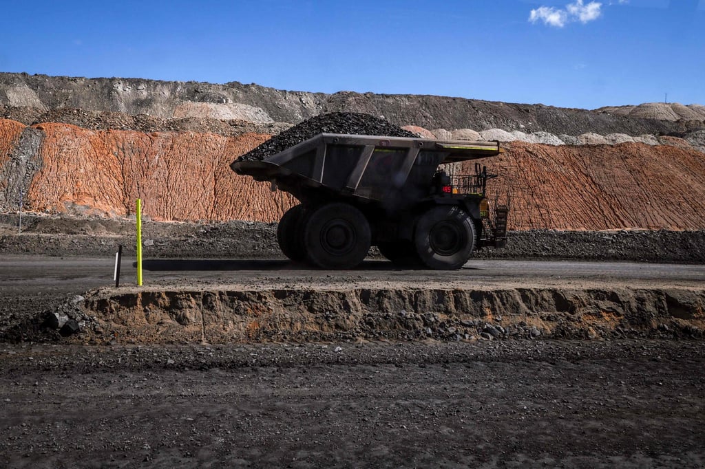 A coal hauler truck drives along a road with a load at the Moolarben coal mine, operated by Yancoal Australia, in the western New South Wales coalfields and north of the town of Mudgee on September 3. Australia’s coal mines are expanding as exports boom, awkward timing for a nation preparing to champion clean energy as lead negotiator for the UN climate summit. Photo: AFP