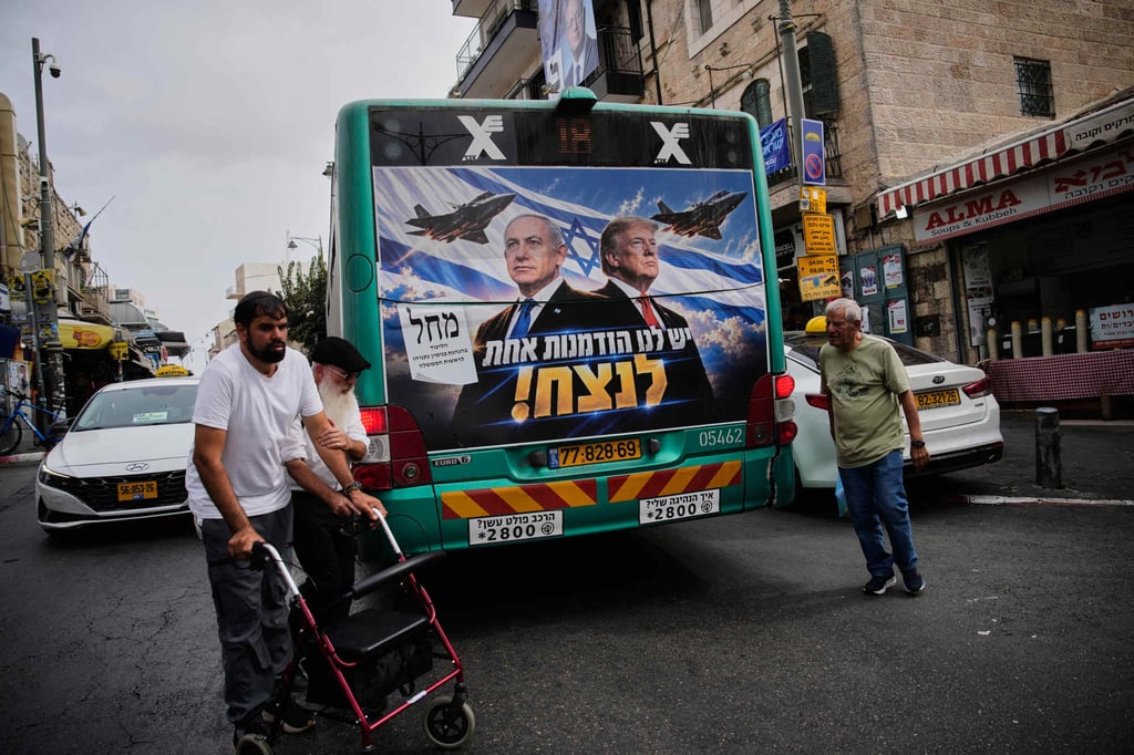 A Likud party campaign ad featuring Netanyahu and US President Donald Trump, with a Hebrew message reading “We have one opportunity to win”, appears on a bus in Jerusalem, Israel on Monday. Photo: AP