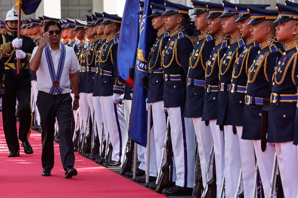 President Ferdinand Marcos Jnr (left) salutes military honour guards during ceremonies marking the 79th founding anniversary of the Philippine Air Force at Villamor Air Base in Pasay City on July 1. Photo: EPA