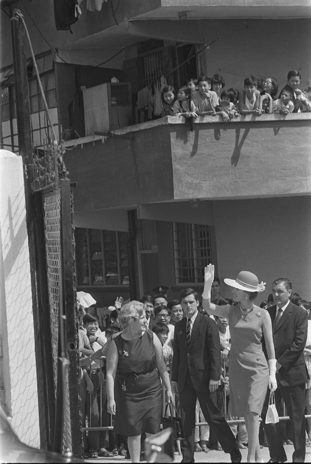 Princess Anne waves to residents crowding on balconies of the Wong Tai Sin Resettlement Estate to catch a glimpse of her. Photo: SCMP Archive