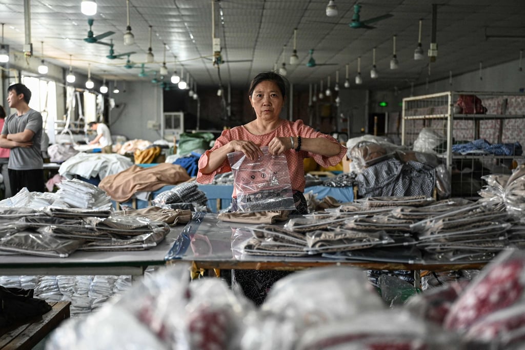 An employee packages garments for Temu at a clothing factory in Guangzhou, in southern China’s Guangdong province. Photo: AFP An employee packages garments for Temu at a clothing factory in Guangzhou, in southern China’s Guangdong province. Photo: AFP
