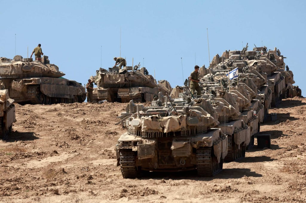 A convoy of Israeli tanks deployed at Israel’s border with the Gaza Strip in September last year. Photo: AFP A convoy of Israeli tanks deployed at Israel’s border with the Gaza Strip in September last year. Photo: AFP