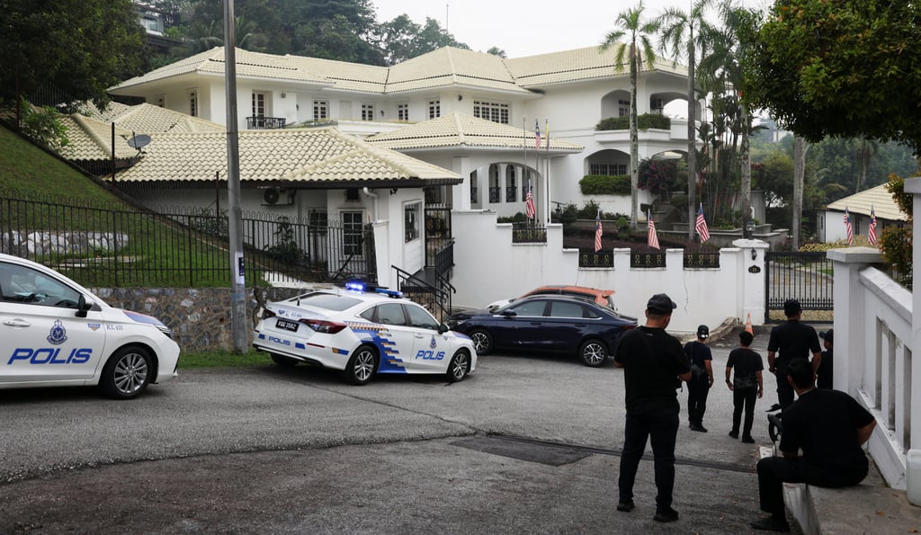Police patrol cars are parked outside Malaysia’s former prime minister Najib Razak’s house in Kuala Lumpur on September 18. Photo: Reuters