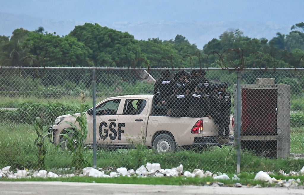Special forces from El Salvador ride in a Gang Suppression Force (GSF) truck in Port-au-Prince, Haiti. Photo: TNS