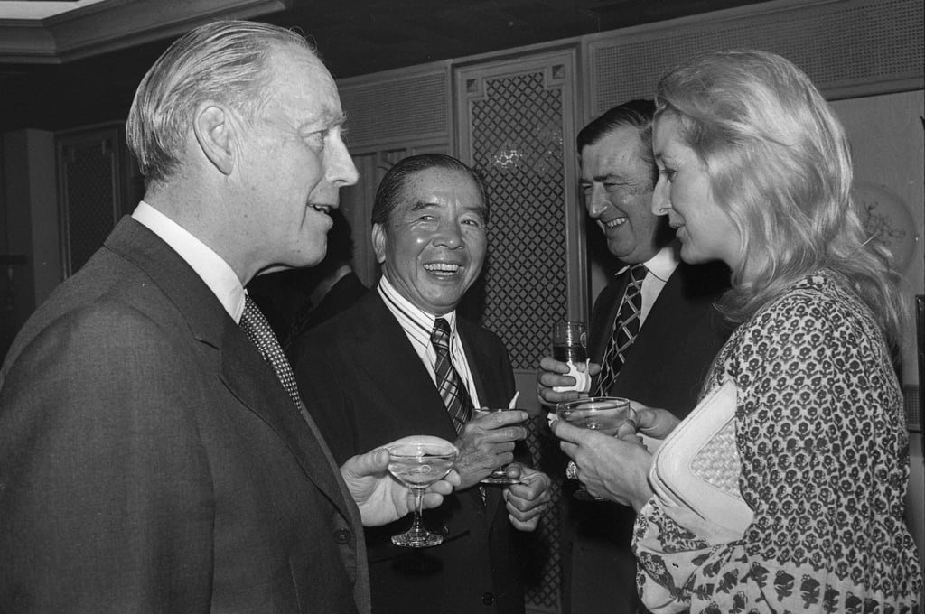 Sir Paul Bryan (left) is seen talking to Lady Kitson while shipping tycoon Sir Yue-kong Pao (second left) and Sir Timothy Kitson look on. Sir Paul and Sir Timothy were on a visit to Hong Kong in January, 1979. Photo: SCMP Sir Paul Bryan (left) is seen talking to Lady Kitson while shipping tycoon Sir Yue-kong Pao (second left) and Sir Timothy Kitson look on. Sir Paul and Sir Timothy were on a visit to Hong Kong in January, 1979. Photo: SCMP