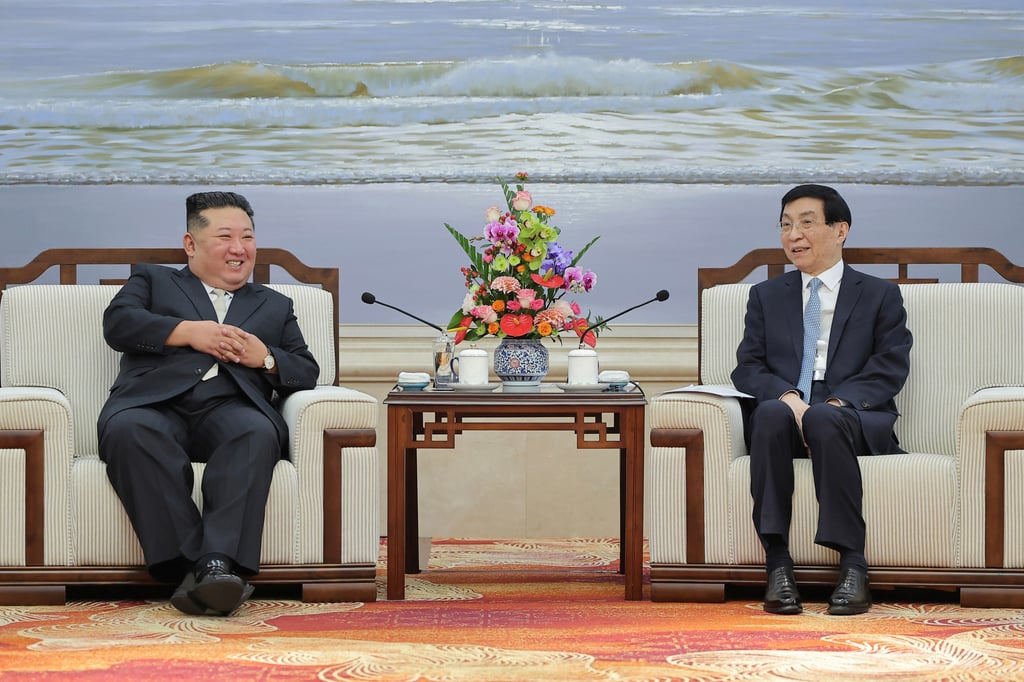North Korean leader Kim Jong-un (left) speaks with Wang Huning, China’s fourth-ranking official, in Dandong, China, on Saturday. Photo: EPA North Korean leader Kim Jong-un (left) speaks with Wang Huning, China’s fourth-ranking official, in Dandong, China, on Saturday. Photo: EPA