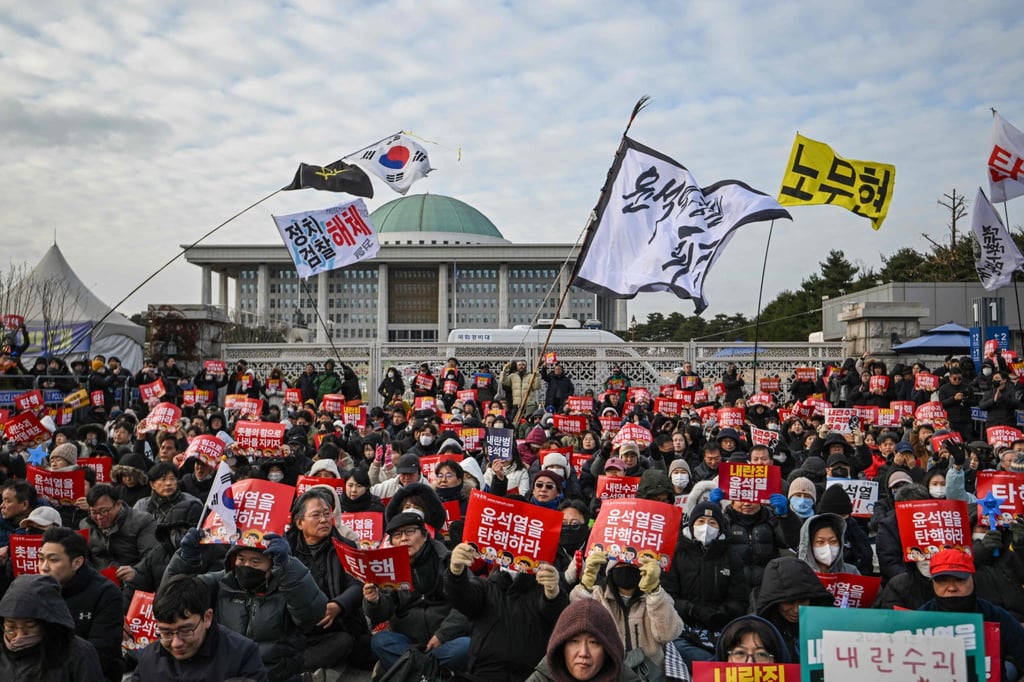 People take part in a protest calling for the ousting of then South Korean president Yoon Suk-yeol outside the National Assembly in Seoul on December 7, 2024. Photo: AFP People take part in a protest calling for the ousting of then South Korean president Yoon Suk-yeol outside the National Assembly in Seoul on December 7, 2024. Photo: AFP
