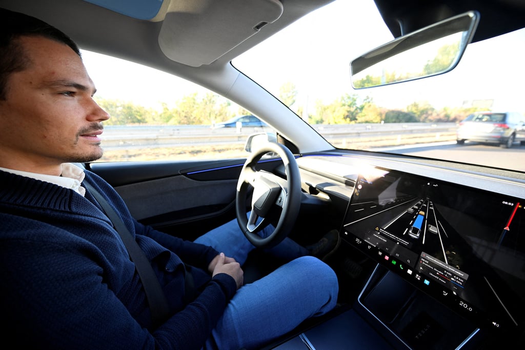 A Tesla driver takes part in a full self-driven ride through Bratislava, Slovakia, on Friday. Photo: Reuters