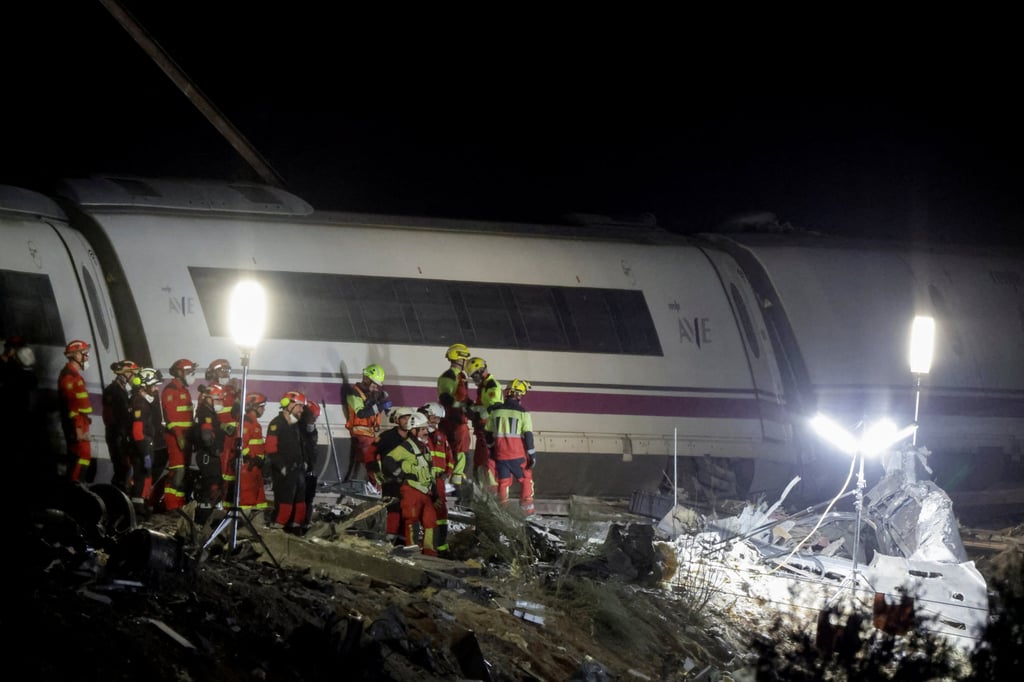 Rescue personnel at the crash site. Photo: Reuters