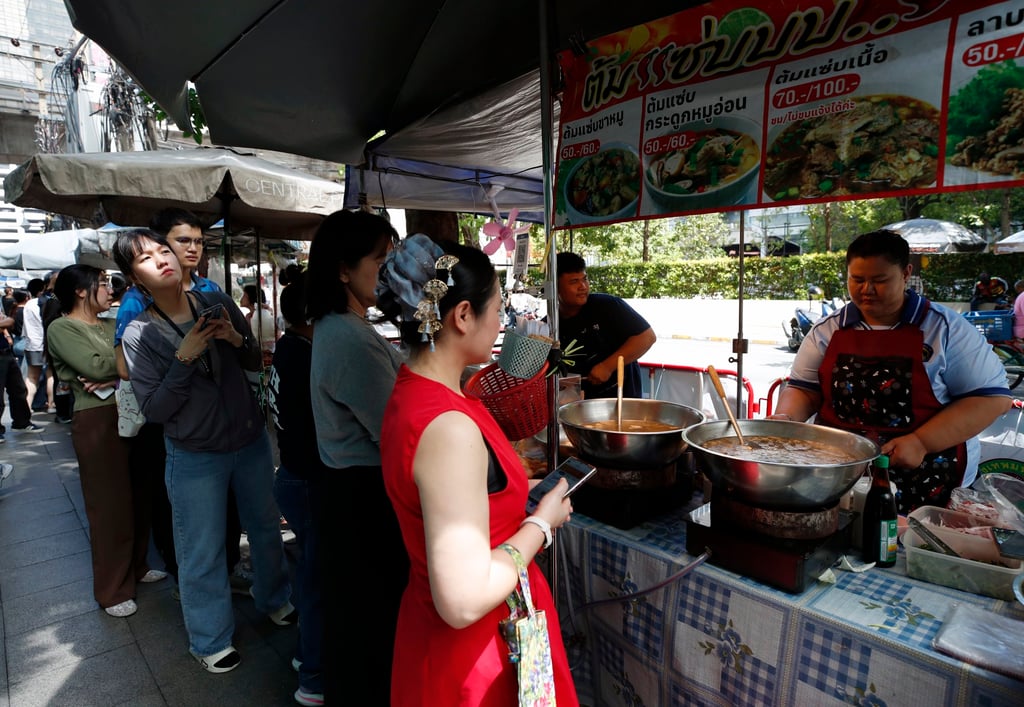 Thai office workers buy street food in Bangkok’s Silom district, in October. The kingdom’s massive food economy presents a major headache for authorities, with experts warning that weak traceability makes tracking illicit imports very difficult. Photo: EPA Thai office workers buy street food in Bangkok’s Silom district, in October. The kingdom’s massive food economy presents a major headache for authorities, with experts warning that weak traceability makes tracking illicit imports very difficult. Photo: EPA