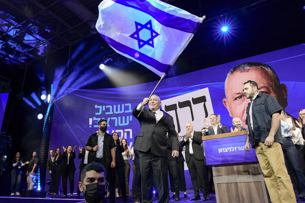 Gadi Eisenkot waves an Israeli flag as he addresses supporters at an election-night rally in Tel Aviv early on Wednesday. Photo: AFP Gadi Eisenkot waves an Israeli flag as he addresses supporters at an election-night rally in Tel Aviv early on Wednesday. Photo: AFP