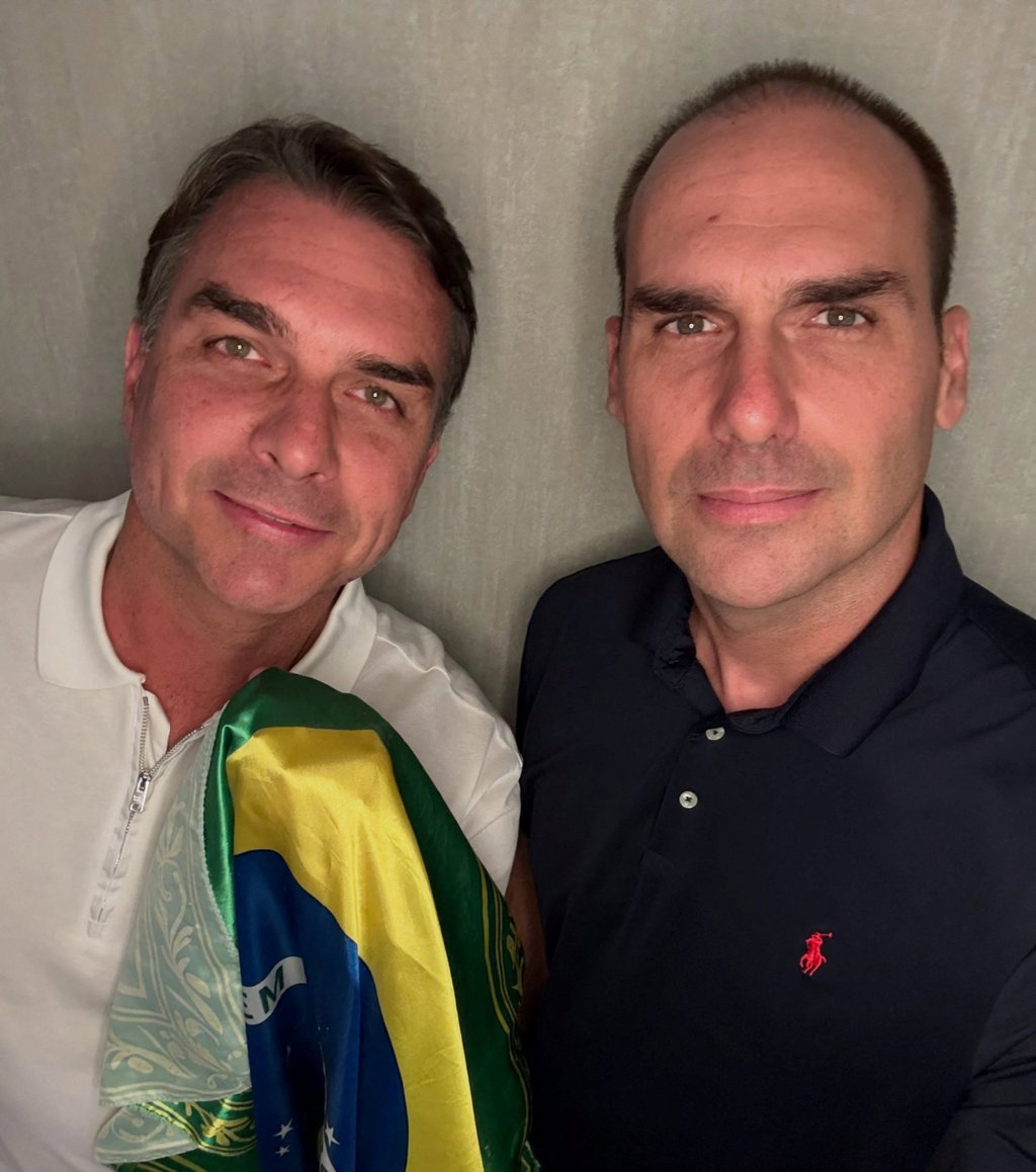 Flavio Bolsonaro (left) and his brother, Eduardo Bolsonaro, pose with a Brazilian flag at an unidentified location in an image obtained from social media and released on Wednesday. Photo: Instagram/Eduardo Bolsonaro via Reuters Flavio Bolsonaro (left) and his brother, Eduardo Bolsonaro, pose with a Brazilian flag at an unidentified location in an image obtained from social media and released on Wednesday. Photo: Instagram/Eduardo Bolsonaro via Reuters