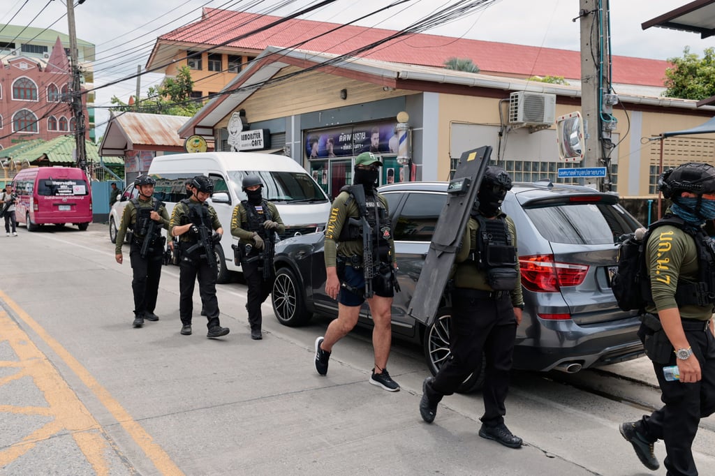 Policemen patrol outside a school in Nonthaburi province, central Thailand, following a shooting in August that left several dead. Photo: AP