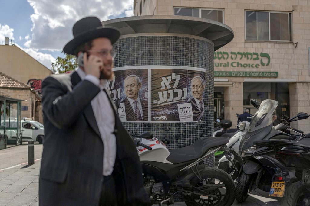 Israelis walk past a poster of Israel’s Prime Minister Benjamin Netanyahu in Jerusalem on Thursday. Photo: TNS Israelis walk past a poster of Israel’s Prime Minister Benjamin Netanyahu in Jerusalem on Thursday. Photo: TNS