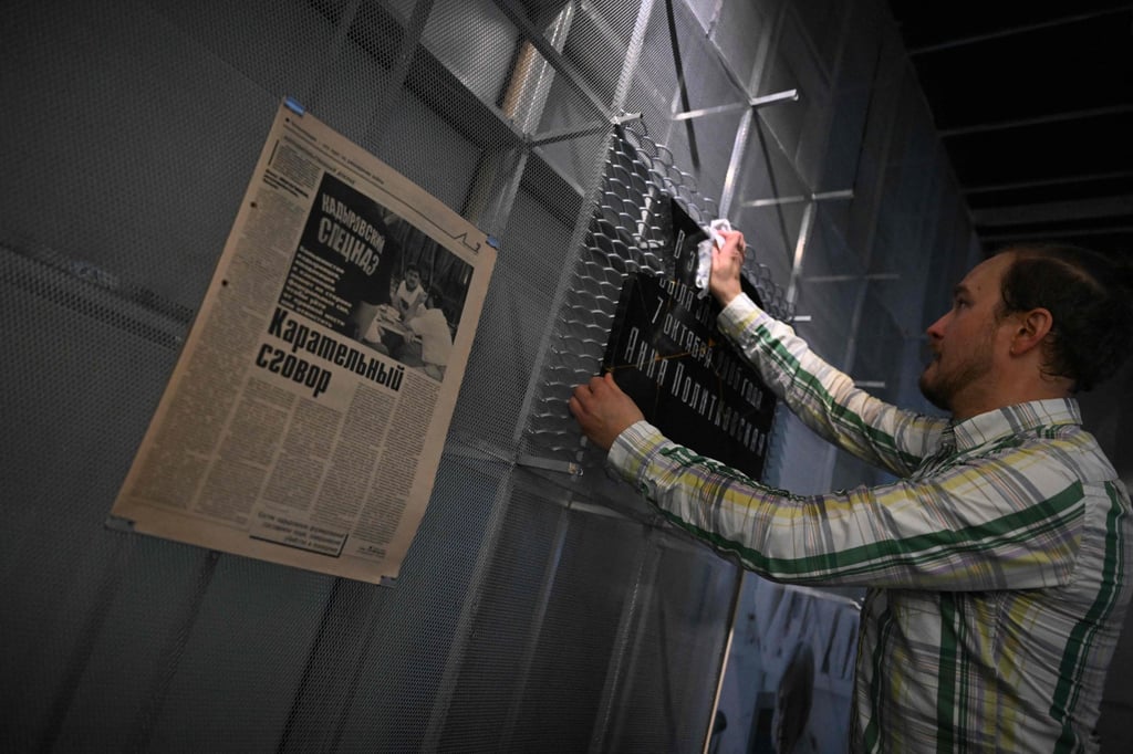 A man fixes a vandalised plaque in Moscow on October 6, outside the building where Novaya Gazeta reporter Anna Politkovskaya was killed. Photo: AFP A man fixes a vandalised plaque in Moscow on October 6, outside the building where Novaya Gazeta reporter Anna Politkovskaya was killed. Photo: AFP