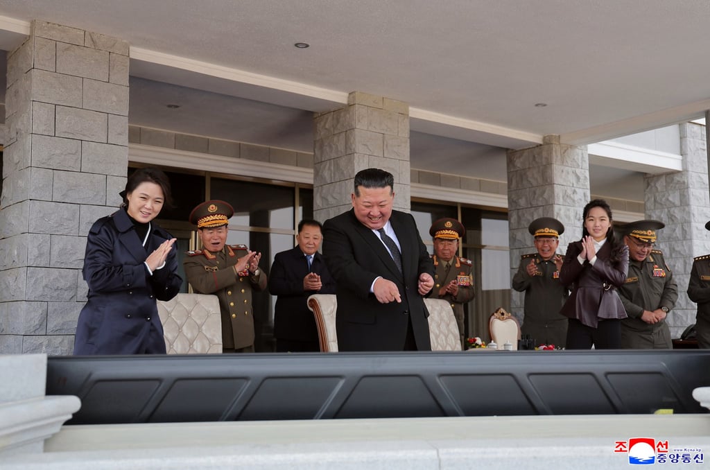 North Korean leader Kim Jong-un (centre), his daughter Kim Ju-ae (second right) and his wife Ri Sol-ju (left) watch a monitor during a drone exhibition on Thursday, in this photo released by state media. Photo: EPA North Korean leader Kim Jong-un (centre), his daughter Kim Ju-ae (second right) and his wife Ri Sol-ju (left) watch a monitor during a drone exhibition on Thursday, in this photo released by state media. Photo: EPA