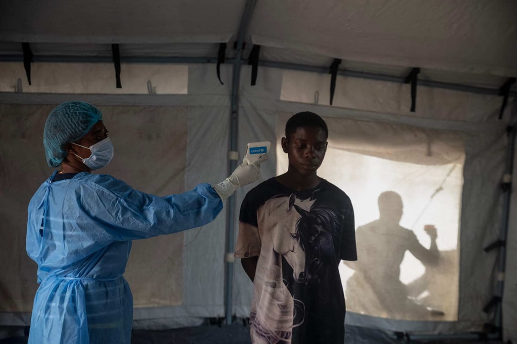 A health worker takes the temperature of a traveller near Bangui in the Central African Republic on Wednesday. The nation borders several countries, including Congo. Photo: AFP A health worker takes the temperature of a traveller near Bangui in the Central African Republic on Wednesday. The nation borders several countries, including Congo. Photo: AFP