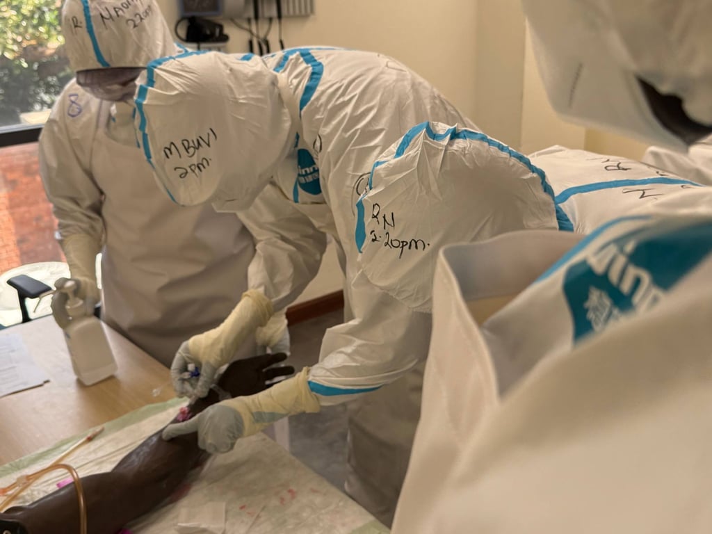 Doctors from various countries in East Africa train in safe practices at an Ebola treatment centre in June. Photo: dpa Doctors from various countries in East Africa train in safe practices at an Ebola treatment centre in June. Photo: dpa