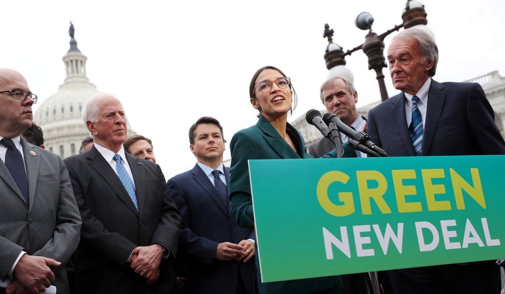 At a news conference in Washington on February 7, US Representative Alexandria Ocasio-Cortez (centre) and Senator Ed Markey (right) unveil a Green New Deal that proposes to eliminate US greenhouse gas emissions within a decade. Photo: Reuters
