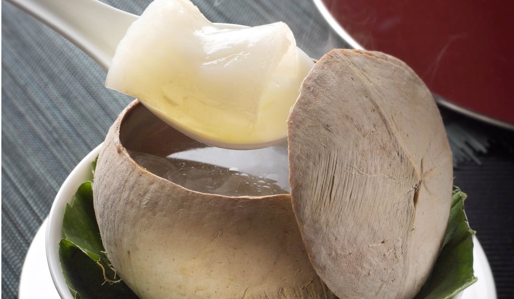 Double-boiled chicken soup with fish maw in baby coconut