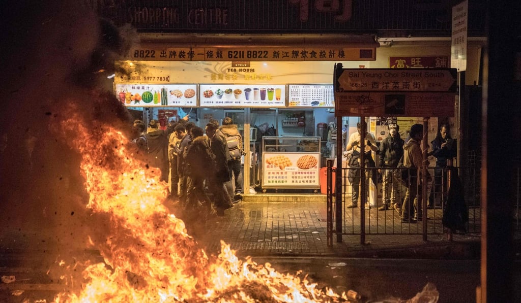 A fire blazes on a street in Mong Kok during unrest on February 8, 2016. Photo: AFP